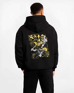 Black hoodie worn by a male model, back view, featuring JoJo’s Bizarre Adventure anime poster inspired The World Stand artwork with striking yellow retro streetwear design.