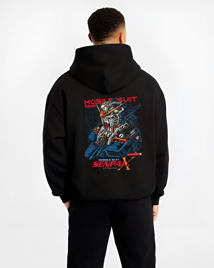 Black hoodie worn by a male model, back view, featuring Mobile Suit mecha helmet artwork in anime poster inspired retro manga style with cyberpunk aesthetic.