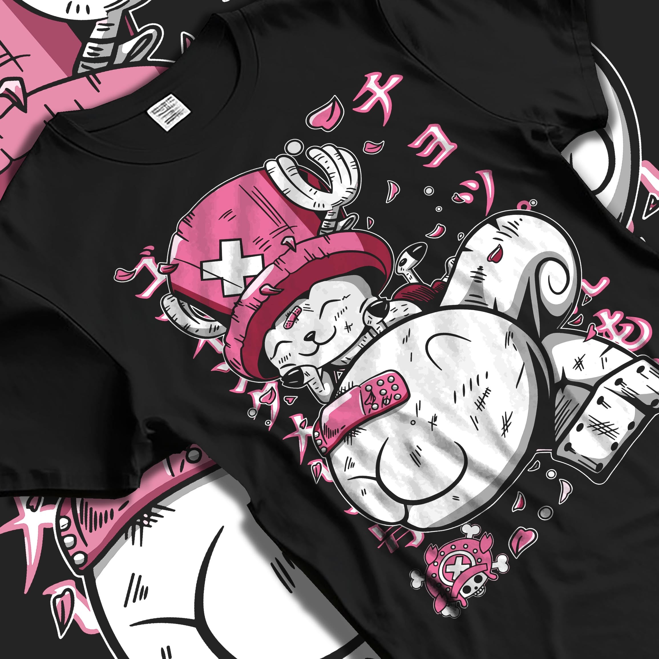 Black T-shirt laid flat with natural fabric folds, featuring One Piece Tony Tony Chopper anime inspired pink and white playful manga graphic design.