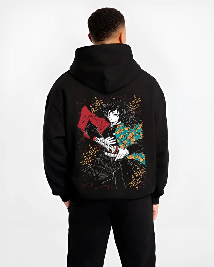 Black hoodie worn by male model, back view with Demon Slayer Hoodie Giyu Tomioka Swift Strike Jumper graphic premium wear.