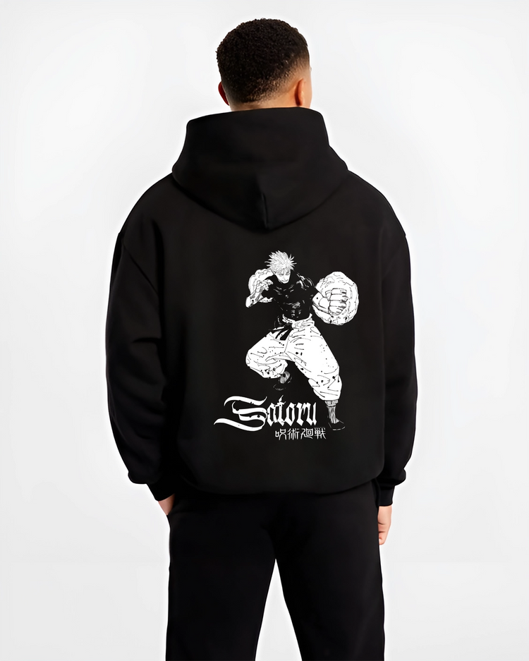 Black hoodie worn by a male model, back view, featuring modern streetwear graphic artwork of Satoru captured in a stylised battle design.