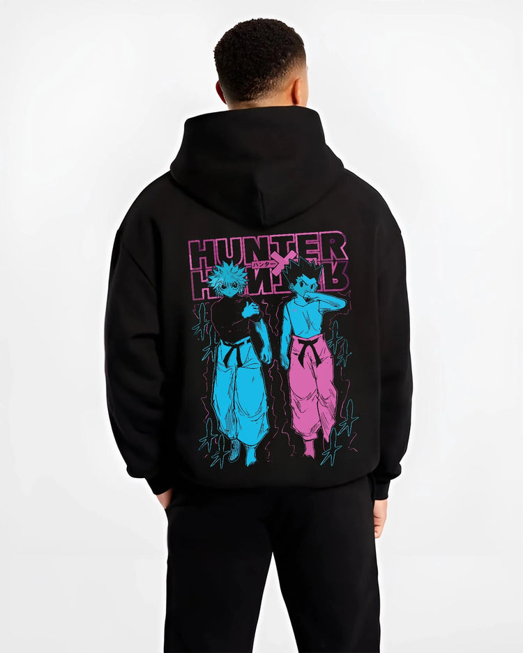 Black hoodie worn by male model, back view with Hunter x Hunter Hoodie Gon Killua Duo Jumper graphic premium wear.