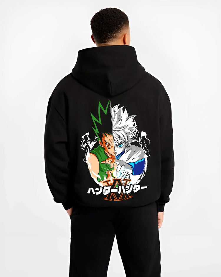 Black hoodie worn by male model, back view with Hunter x Hunter Hoodie Gon Killua Team Jumper graphic bold anime graphic.
