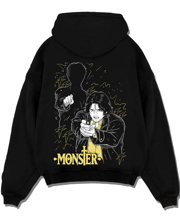 Black pullover hoodie laid flat with Monster Hoodie Johan Dark Mystery Thriller Jumper graphic bold anime graphic.