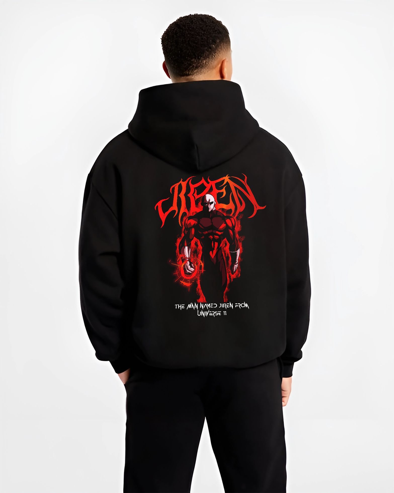 Black hoodie worn by a male model, back view, featuring Dragon Ball Super Jiren shonen battle character graphic with red flames and bold manga style.