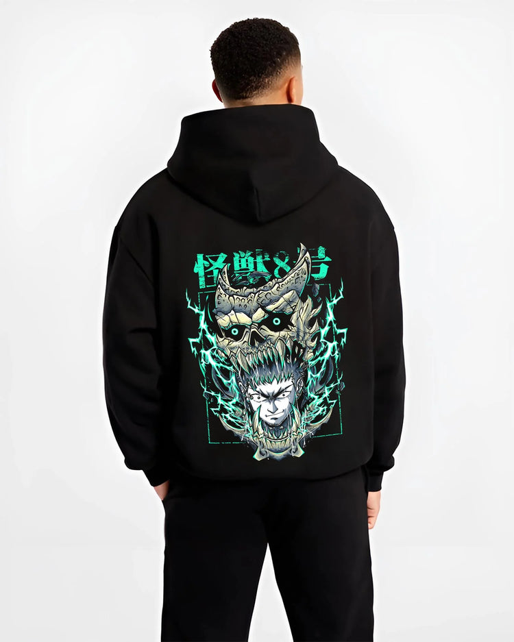 Black hoodie worn by male model, back view with Kaiju No. 8 Hoodie Kafka Hibino Fiery Skull Form graphic premium wear.