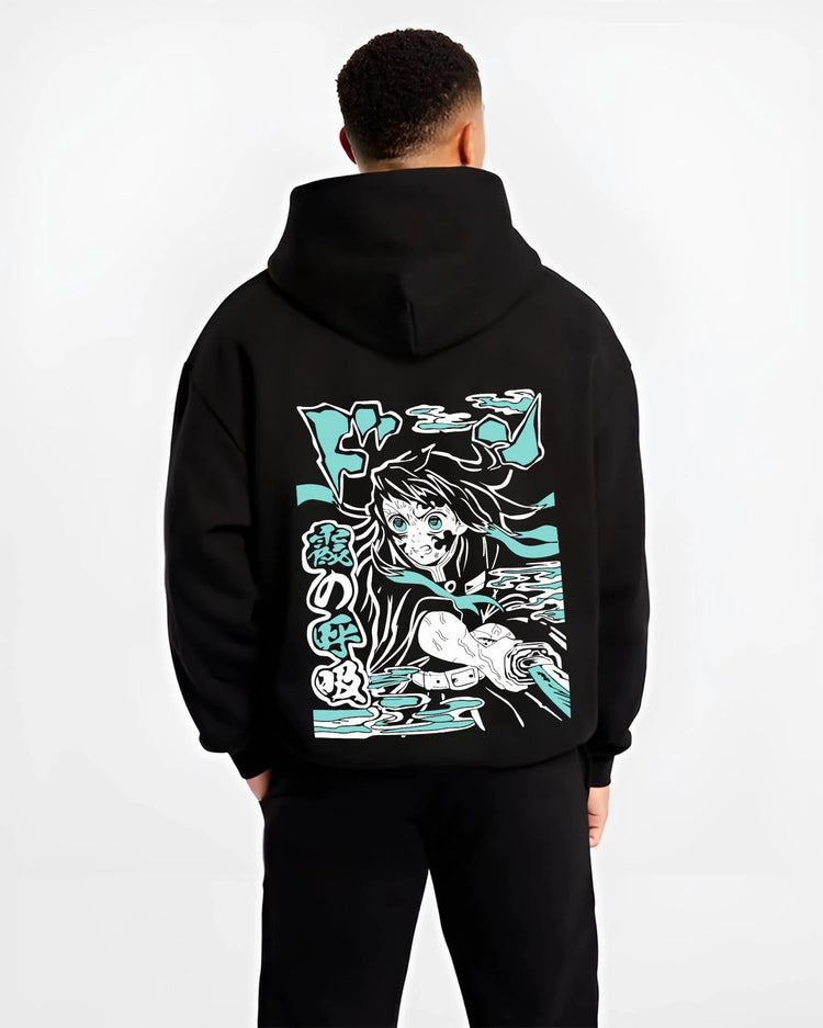 Black hoodie worn by male model, back view with Nezuko Kamado Hoodie Demon Slayer Transformation graphic streetwear graphic.