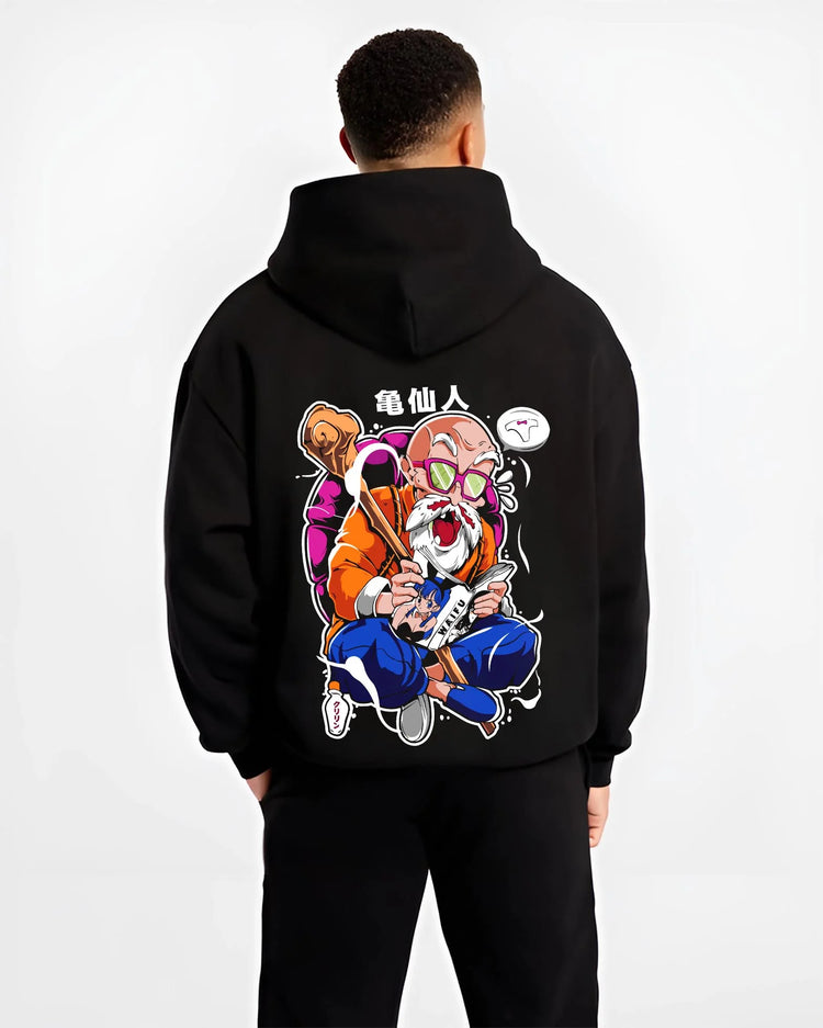 Black hoodie worn by male model, back view with Master Roshi Hoodie Dragon Ball Martial Arts graphic premium wear.