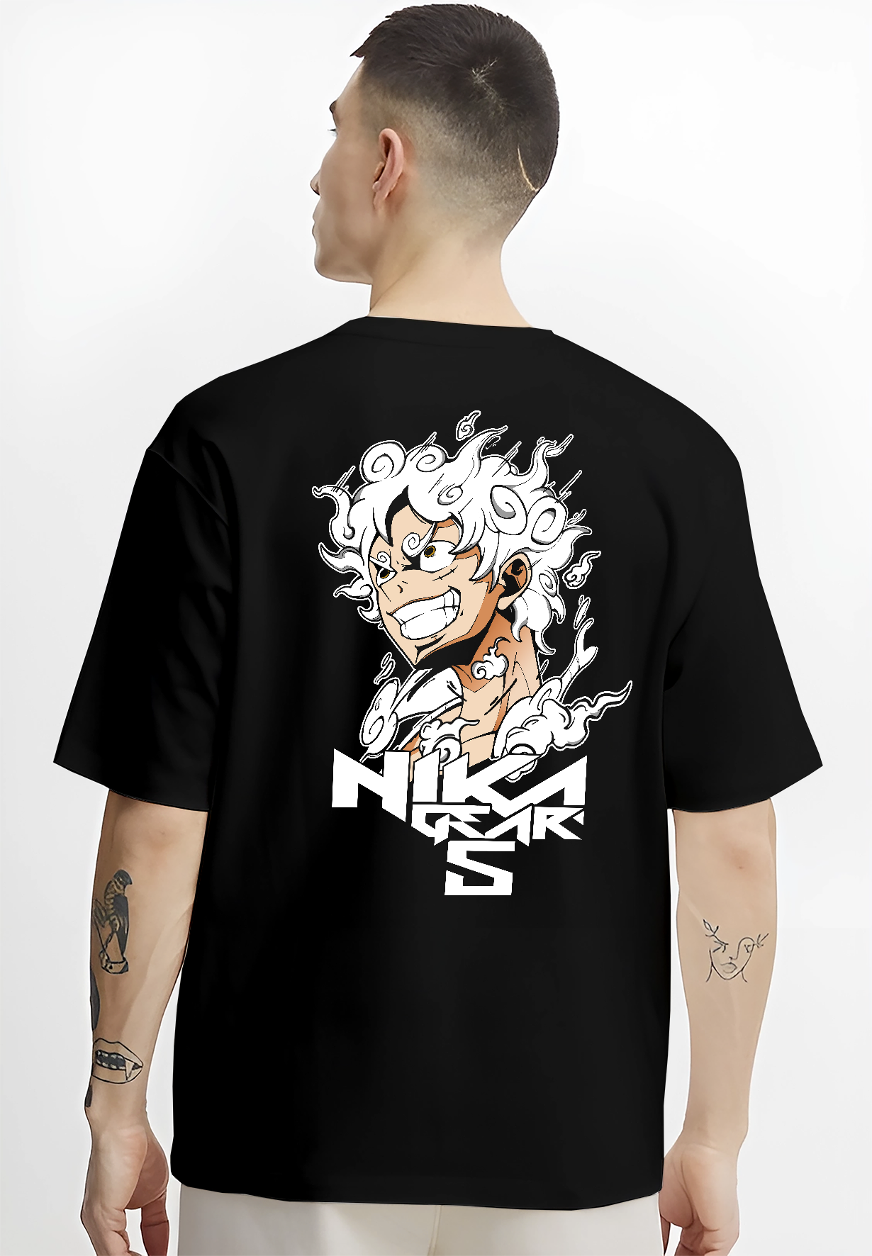 Black T-shirt worn by a male model, back view, featuring One Piece Luffy Gear 5 Japanese animation artwork.