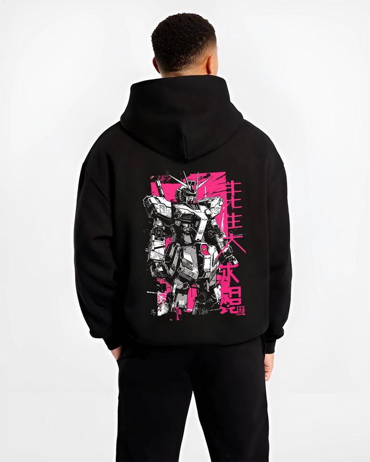 Black hoodie on male model, back view, showing Gundam retro mecha design with bold pink background and vertical Japanese lettering.