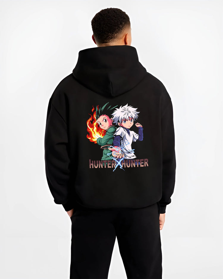 Black hoodie on male model, back view, Hunter x Hunter Gon and Killua anime poster design with pixel art flames and lightning.