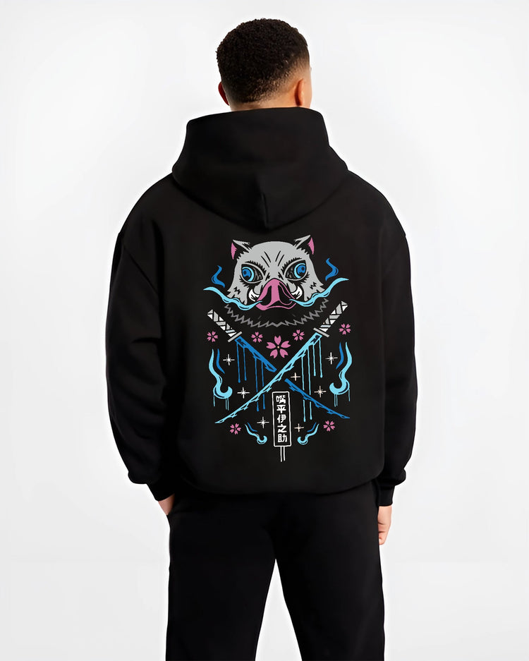 Black hoodie on male model, back view, featuring Inosuke boar mask retro manga graphic with crossed swords, blue flames, and sakura accents.