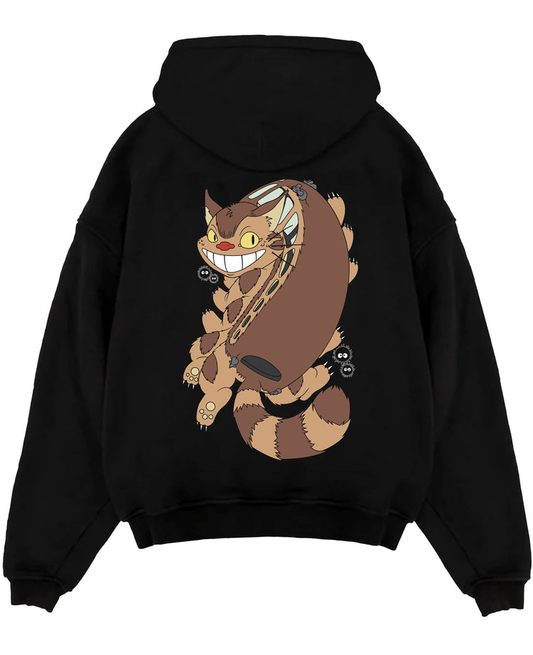 Black pullover hoodie laid flat on a white background, featuring Totoro Catbus with soot sprites, Japanese animation streetwear in playful retro manga style.