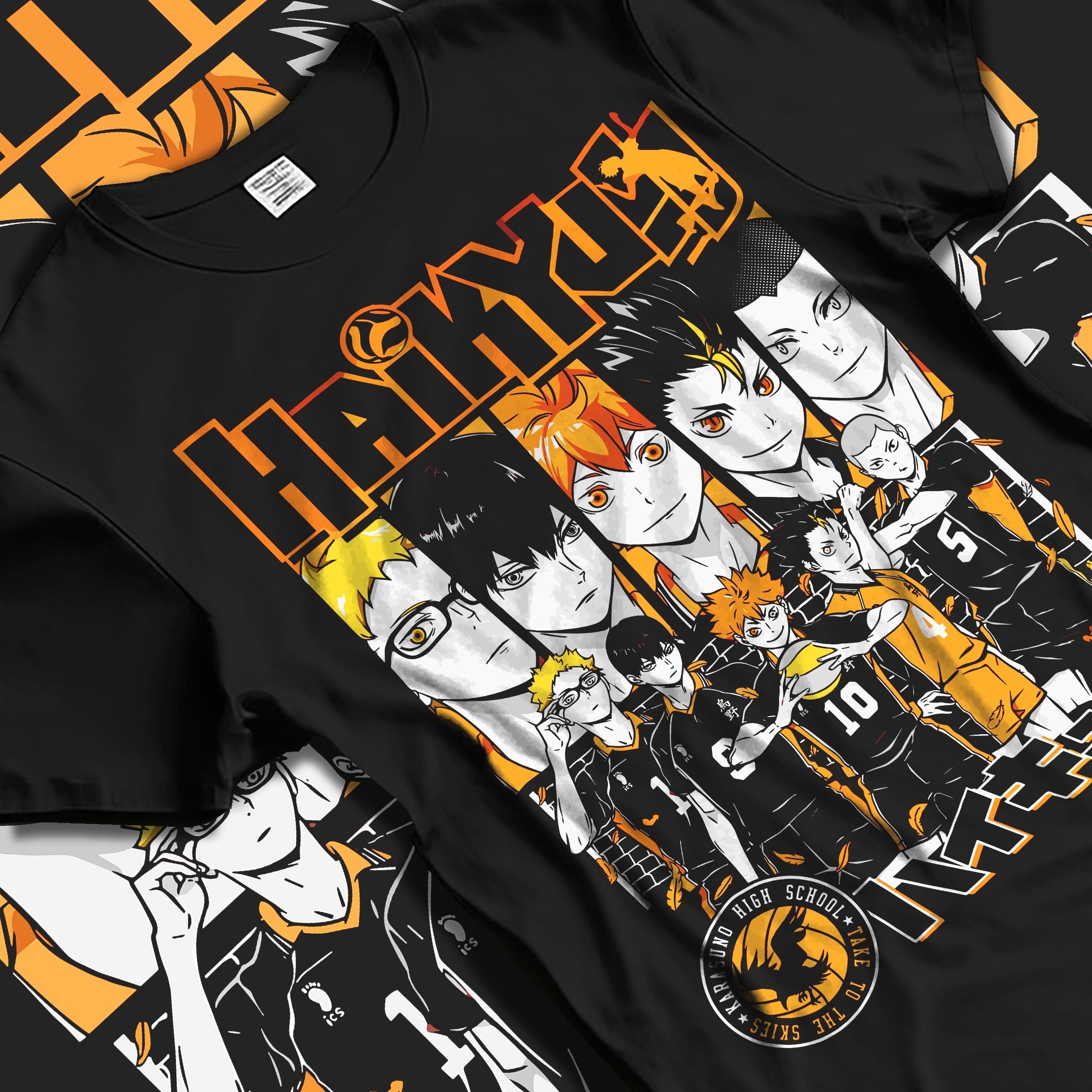 Black T-shirt laid flat featuring Haikyuu!! anime graphic of Karasuno volleyball team lineup with orange highlights and bold series logo.
