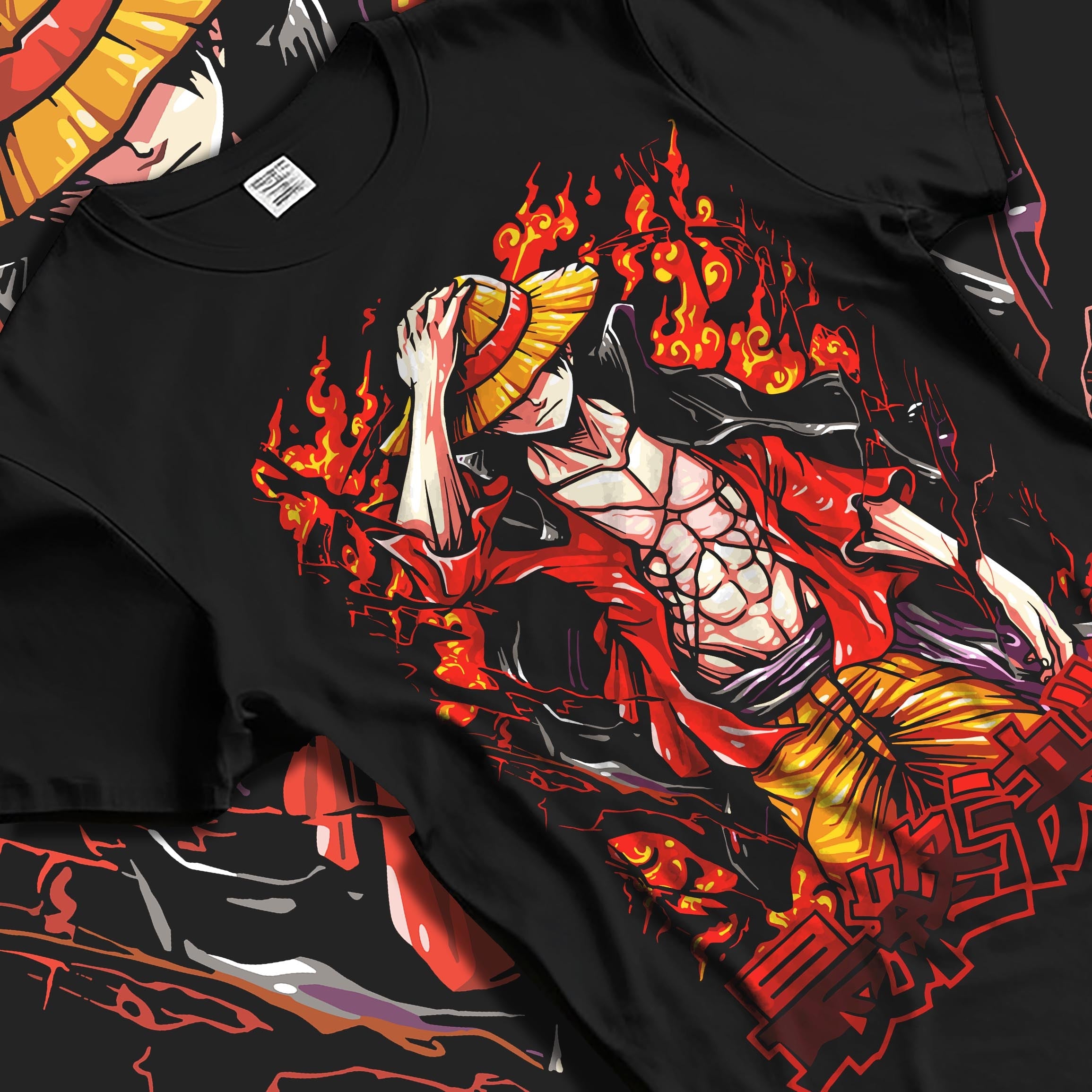 Black T-shirt laid flat featuring Monkey D. Luffy from One Piece in fiery anime poster inspired artwork design with bold colours.