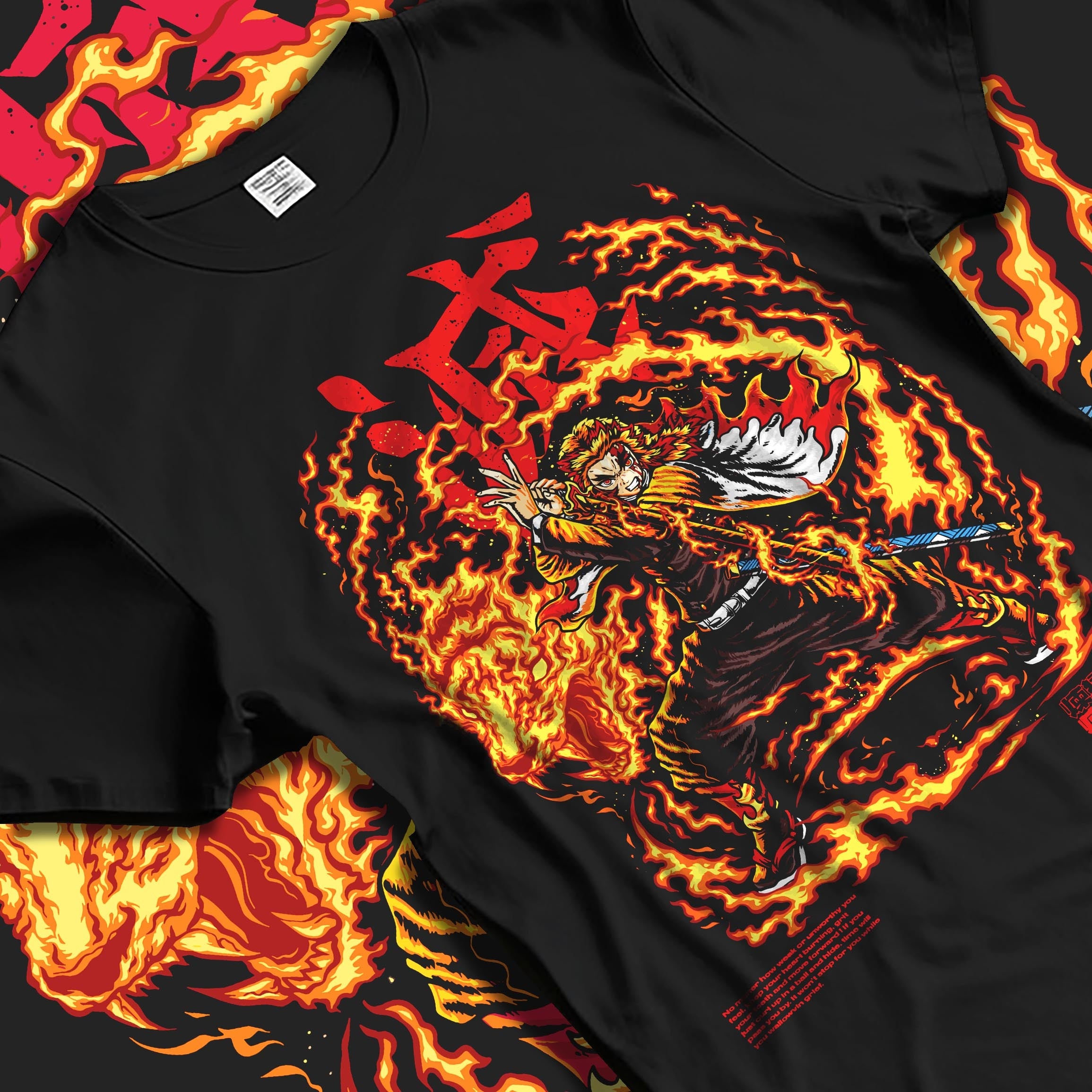 Black T-shirt laid flat featuring Kyojuro Rengoku from Demon Slayer in fiery shonen battle character artwork with bold flame graphics.