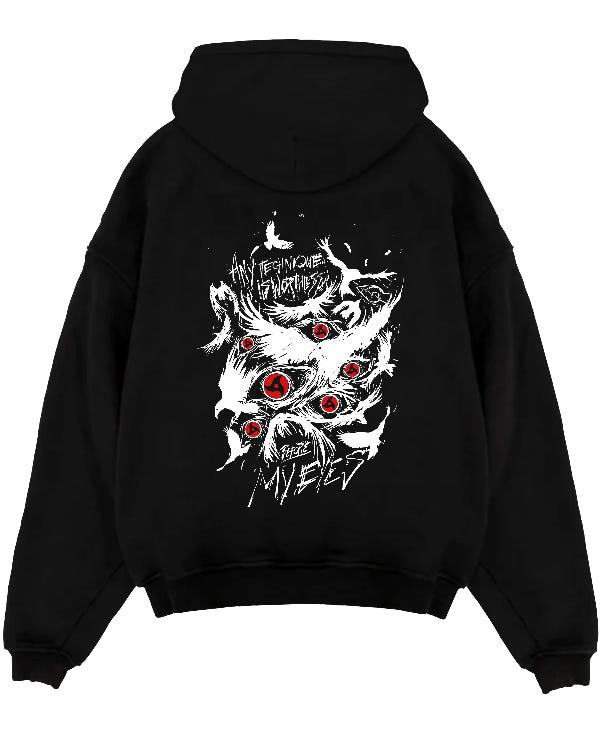 Black pullover hoodie laid flat on a white background, featuring Naruto Sharingan anime poster inspired design with bold red eyes and dark manga panel artwork.