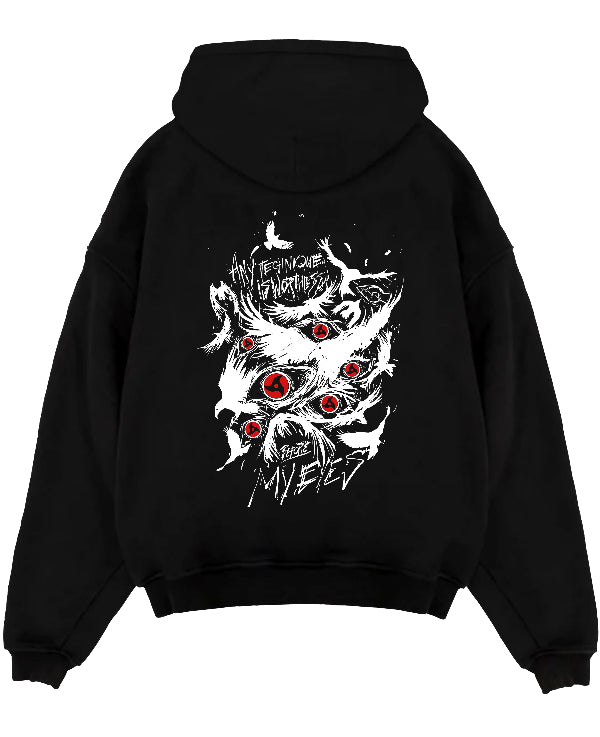 Black pullover hoodie laid flat on a white background, featuring Naruto Sharingan anime poster inspired design with bold red eyes and dark manga panel artwork.