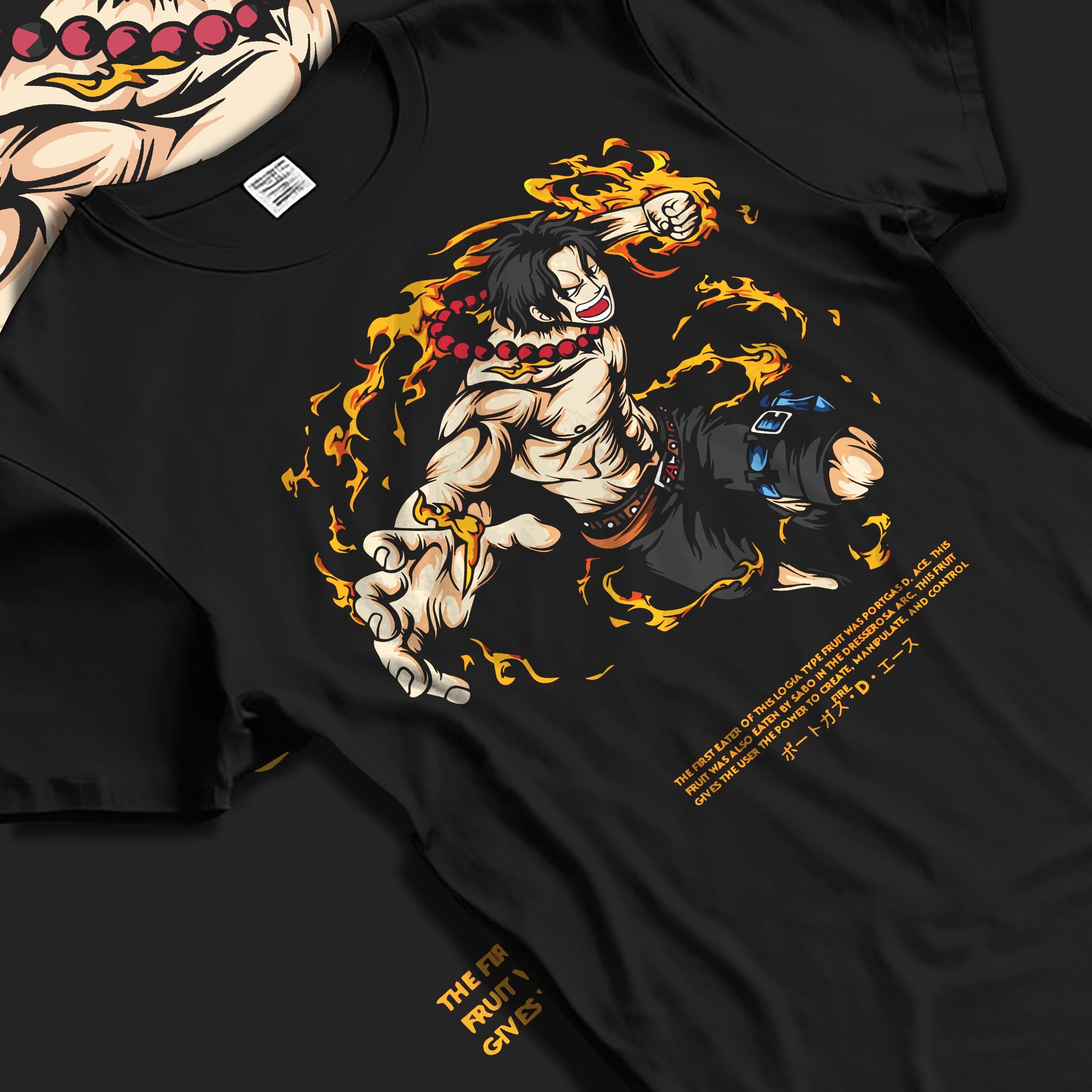 Black T-shirt laid flat with natural fabric folds, featuring One Piece Portgas D. Ace shonen battle character artwork in fiery Japanese animation streetwear style.
