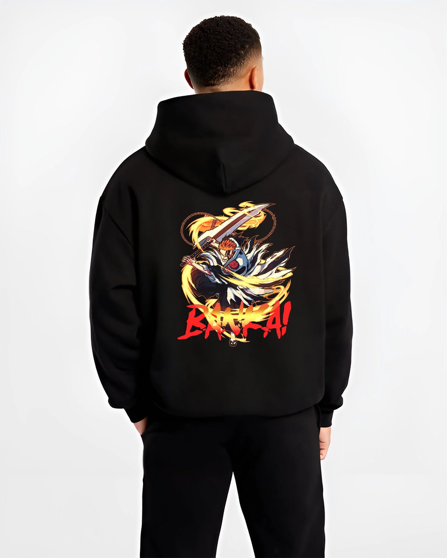 Black hoodie worn by a male model, back view, featuring Bleach Ichigo Bankai Japanese animation streetwear design with glowing sword and fiery aura.