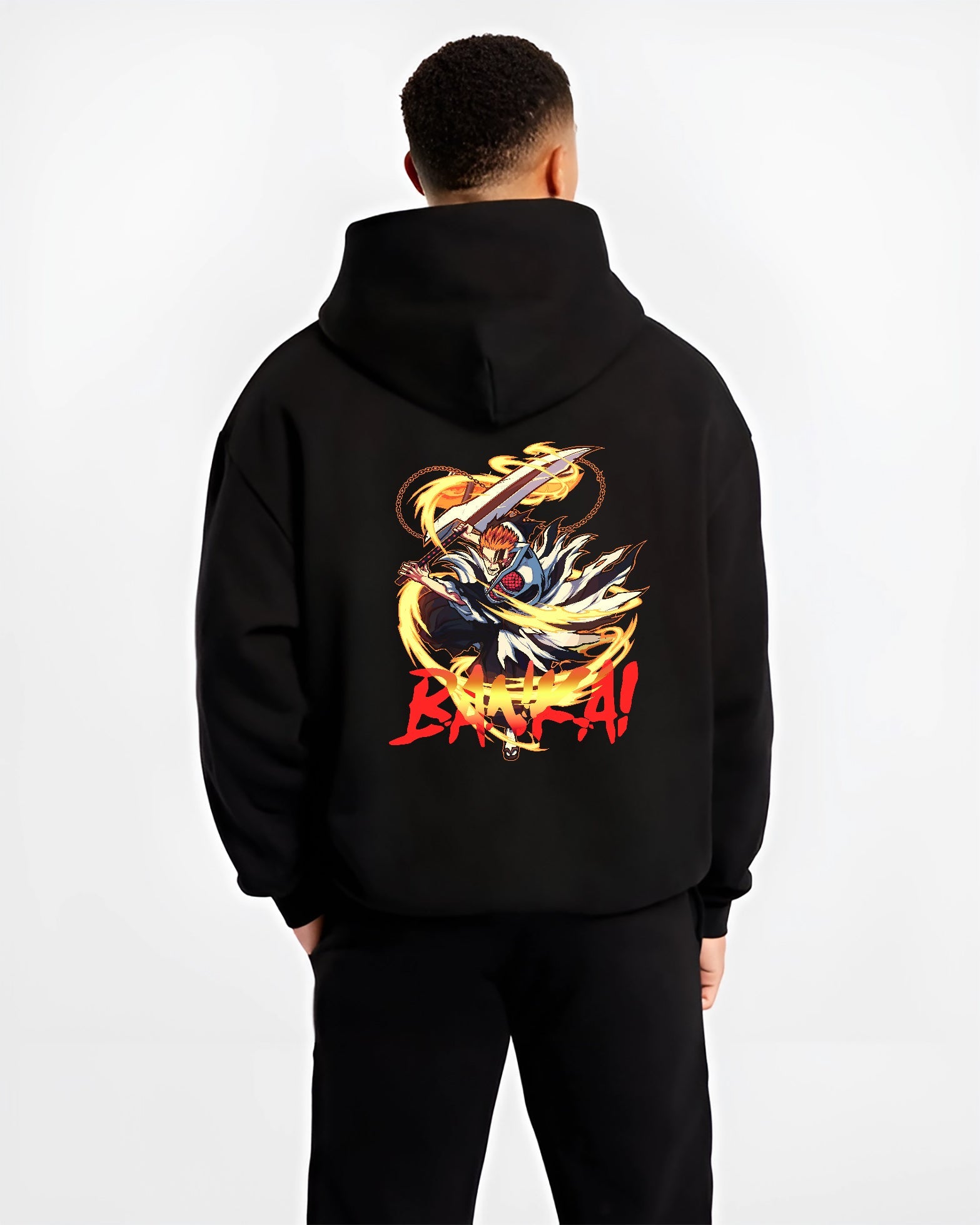 Black hoodie worn by a male model, back view, featuring Bleach Ichigo Bankai Japanese animation streetwear design with glowing sword and fiery aura.