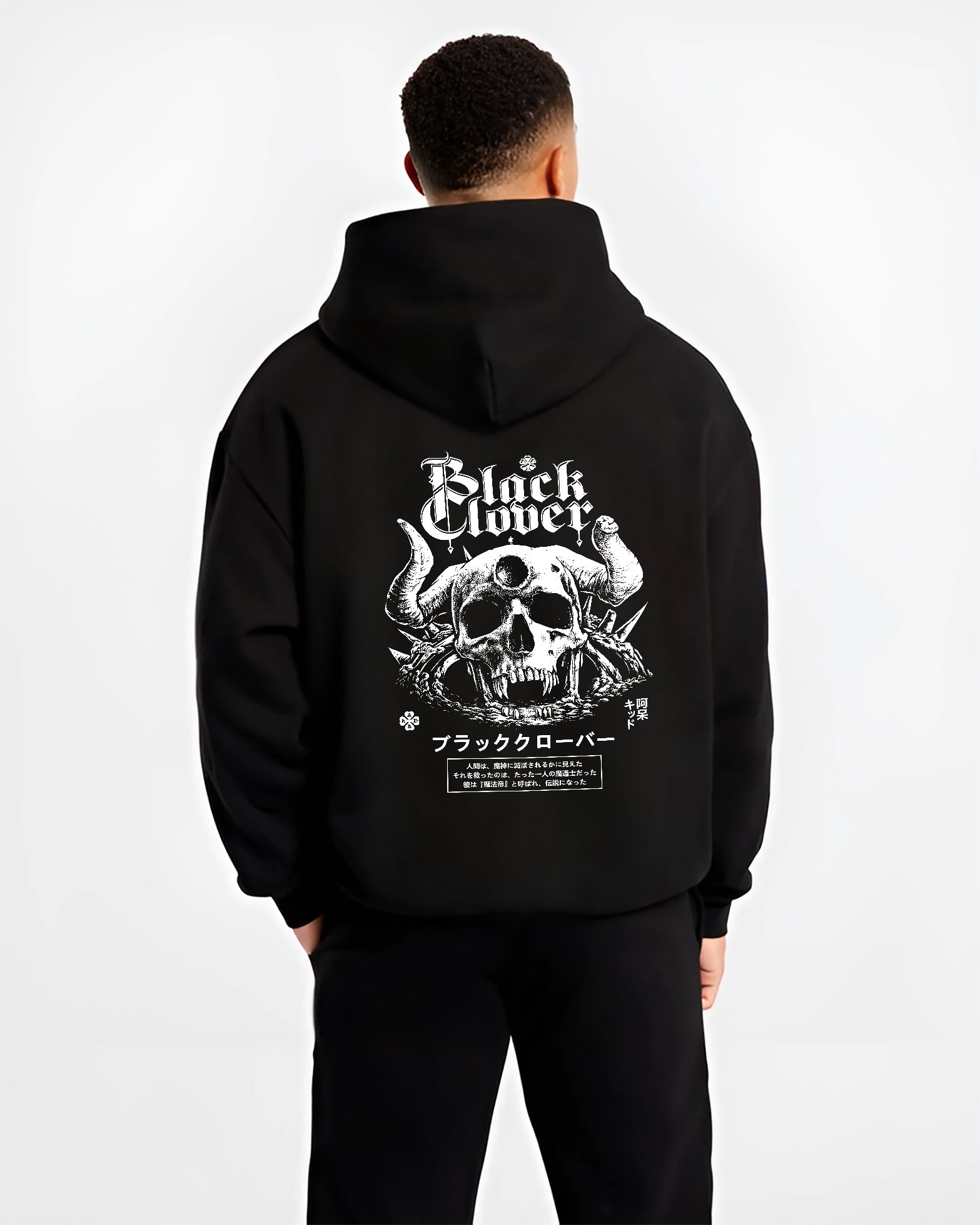 Black hoodie worn by a male model, back view, featuring Black Clover anime poster inspired skull and horns design with bold Japanese manga graphic.