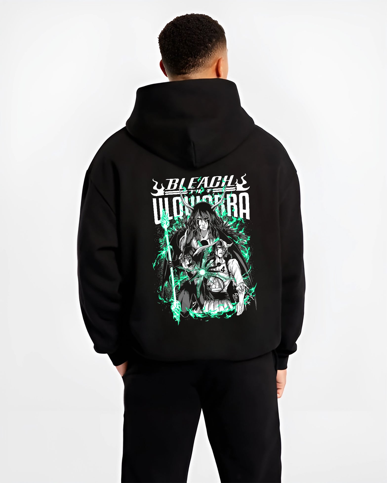Black hoodie worn by a male model, back view, featuring Bleach Ulquiorra Japanese animation streetwear graphic with glowing retro manga panel design.