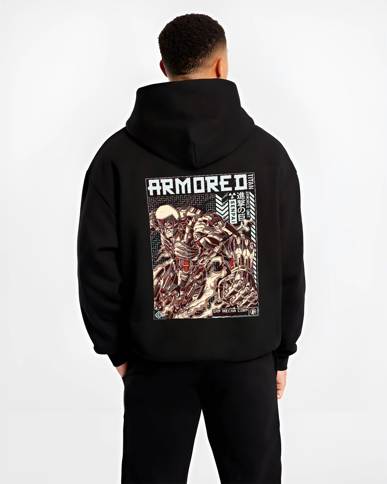 Black hoodie worn by a male model, back view, featuring Attack on Titan Armored Titan anime poster inspired artwork with gritty retro manga panel and armored detail.