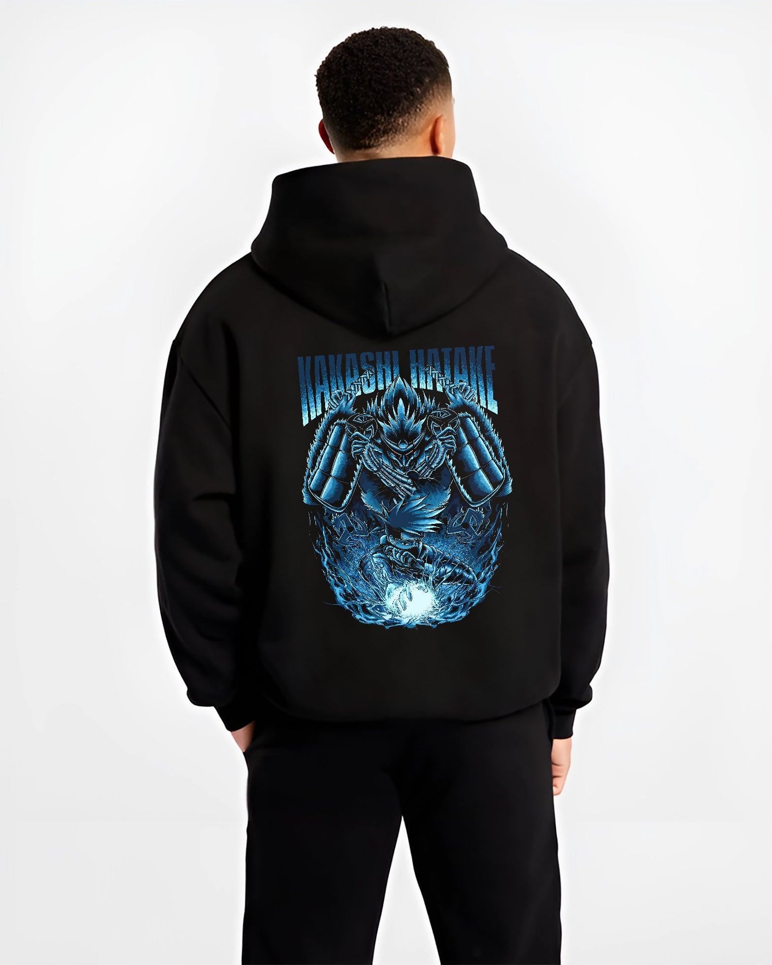 Black hoodie worn by a male model, back view, featuring Kakashi Hatake shonen battle character design with Susanoo aura and retro manga artwork.