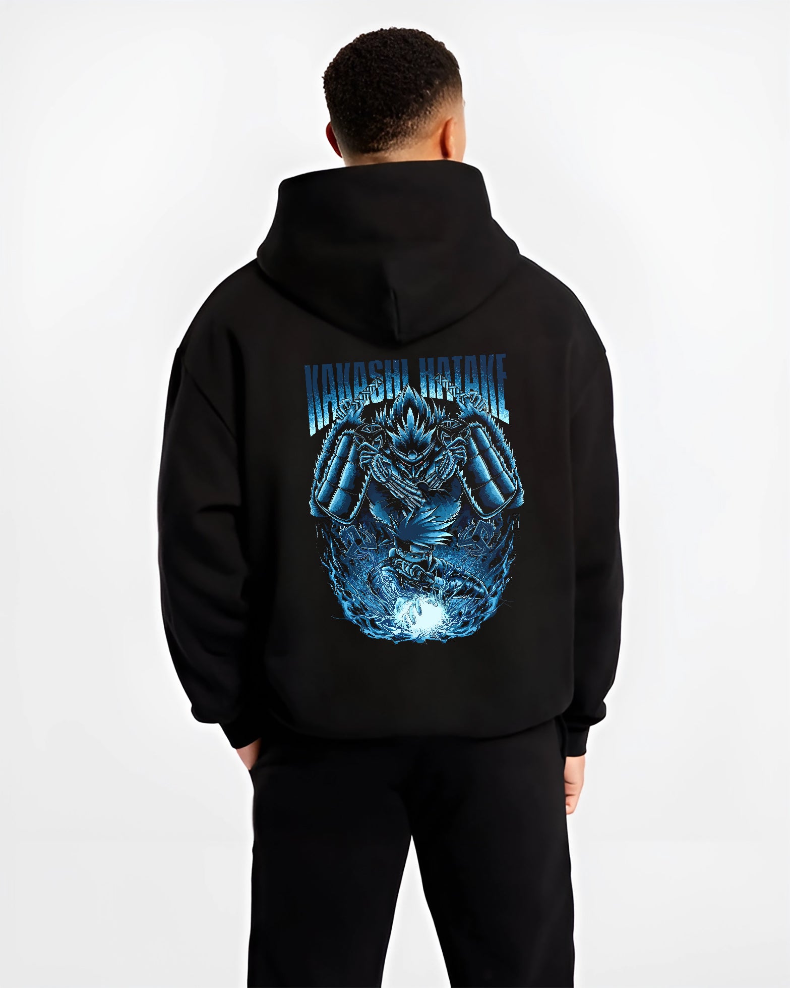 Black hoodie worn by a male model, back view, featuring Kakashi Hatake shonen battle character design with Susanoo aura and retro manga artwork.