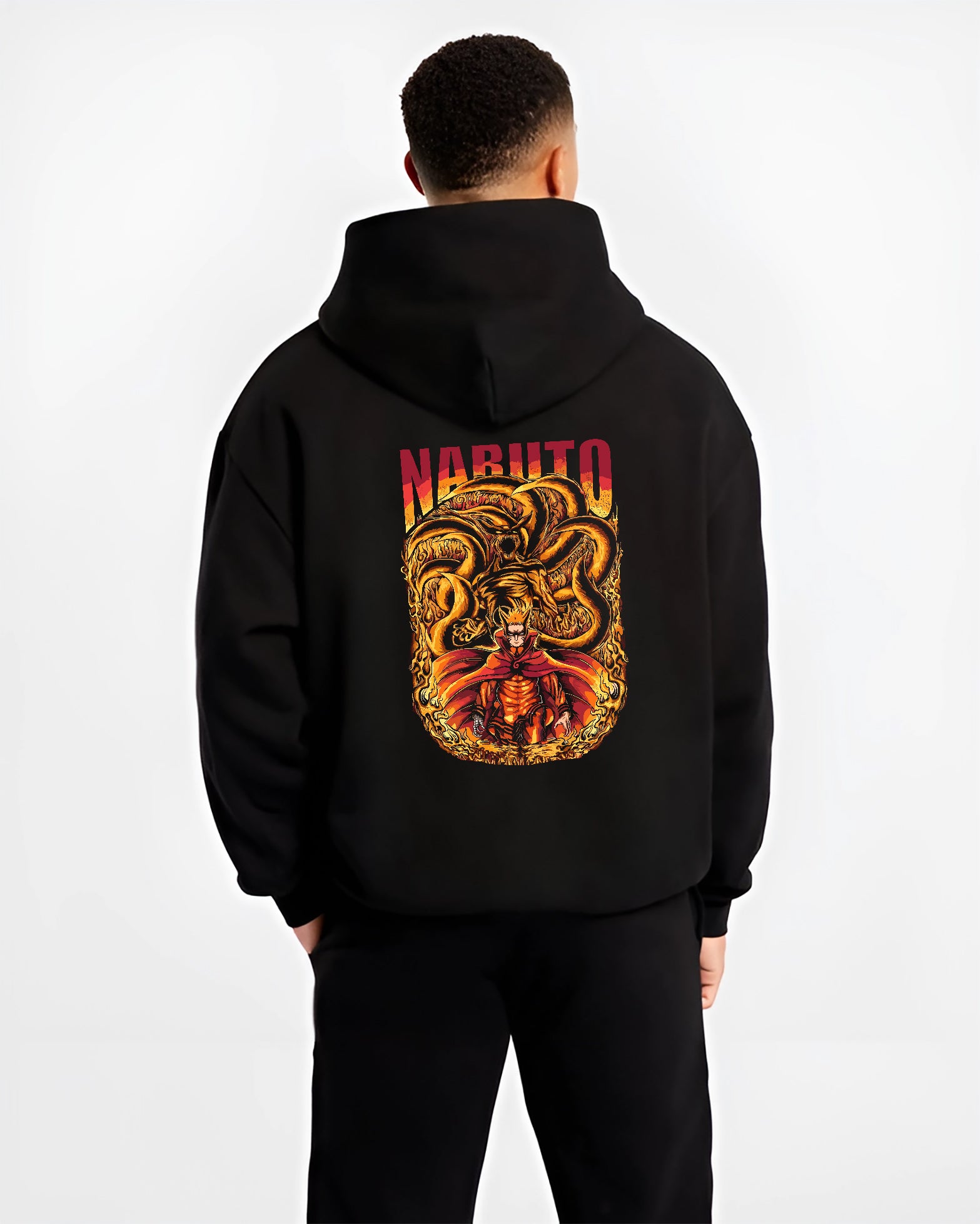 Black hoodie worn by a male model, back view, featuring Naruto with Kurama fiery retro manga style artwork in anime poster inspired design.