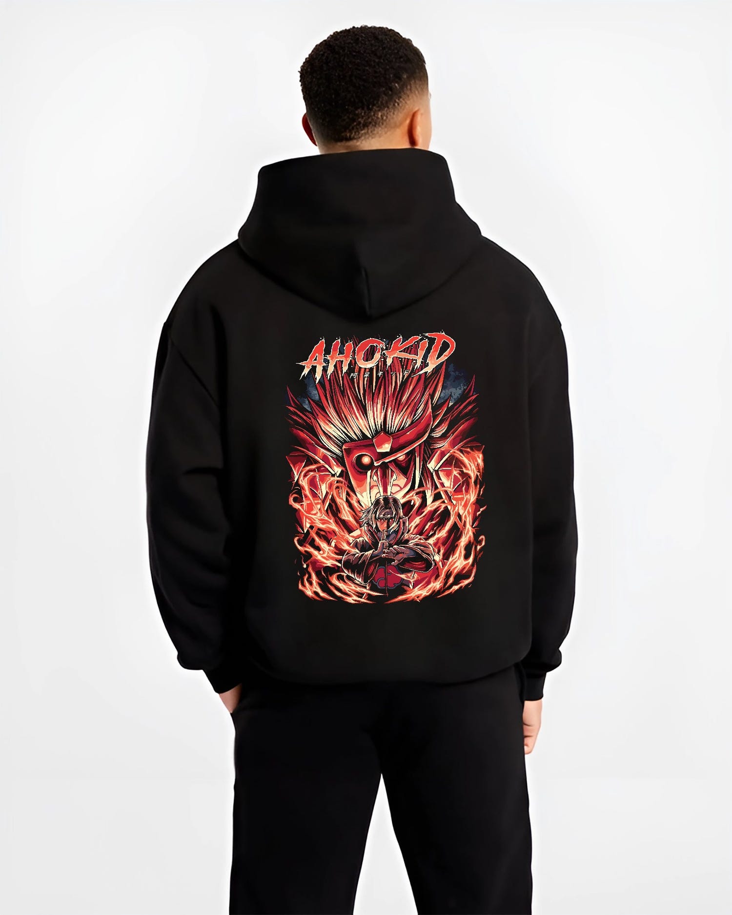 Black hoodie worn by a male model, back view, featuring Naruto Itachi Uchiha retro manga graphic with Sharingan eyes and blazing Susanoo.