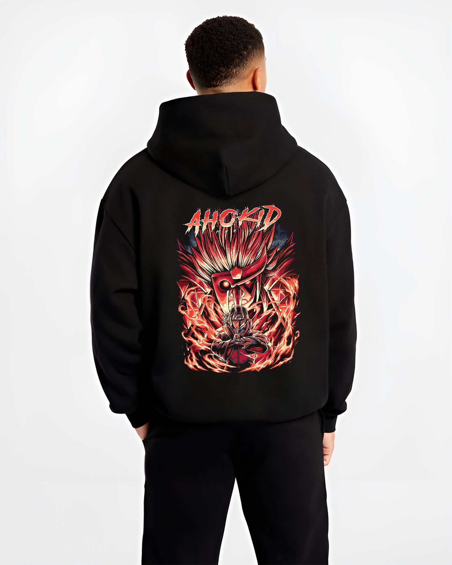 Black hoodie worn by a male model, back view, featuring Naruto Itachi Uchiha retro manga graphic with Sharingan eyes and blazing Susanoo.