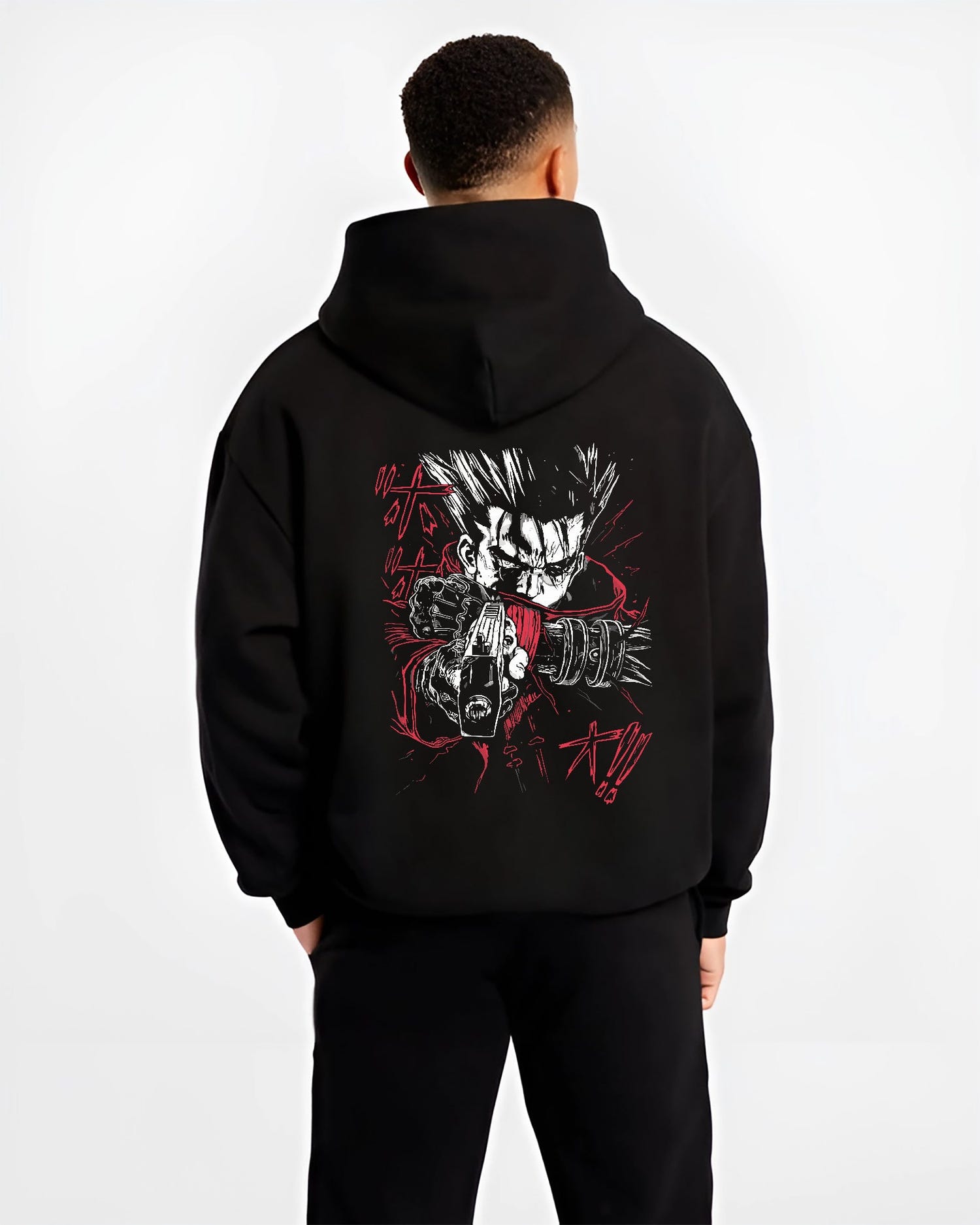 Black hoodie worn by a male model, back view, featuring Vash the Stampede anime poster inspired retro streetwear graphic with intense red and black tones.