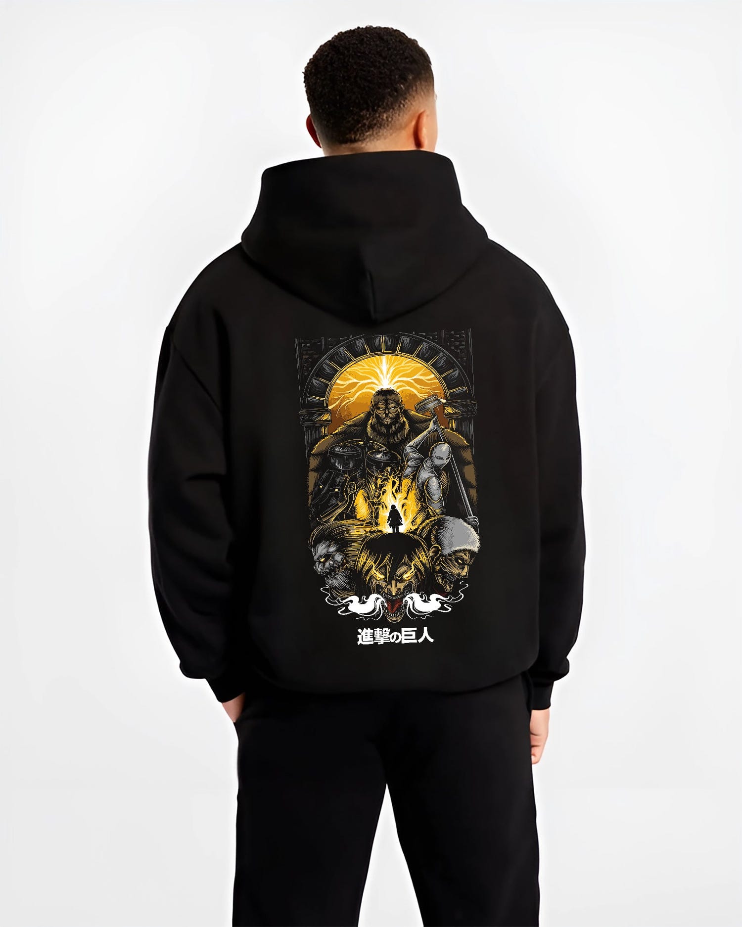 Black hoodie worn by a male model, back view, featuring Attack on Titan retro manga artwork print with Japanese animation streetwear graphic in apocalyptic poster style