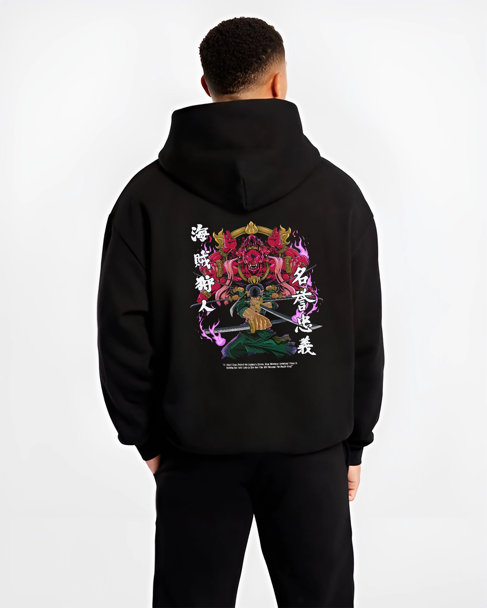 Black hoodie worn by a male model, back view, featuring Zoro One Piece anime poster inspired warrior stance with glowing samurai spirit in bold manga graphic.