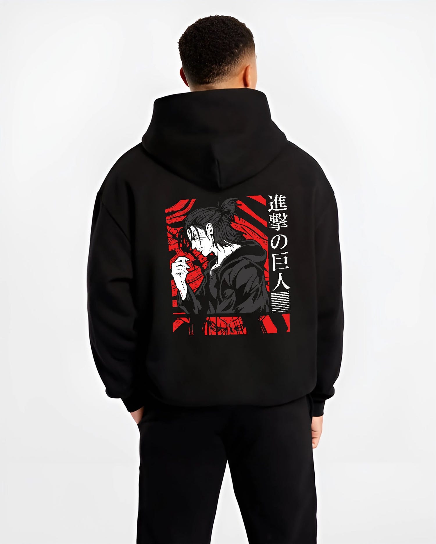 Black hoodie worn by a male model, back view, featuring Attack on Titan Eren Yeager anime poster inspired portrait artwork in gritty retro manga panel style with red accents.