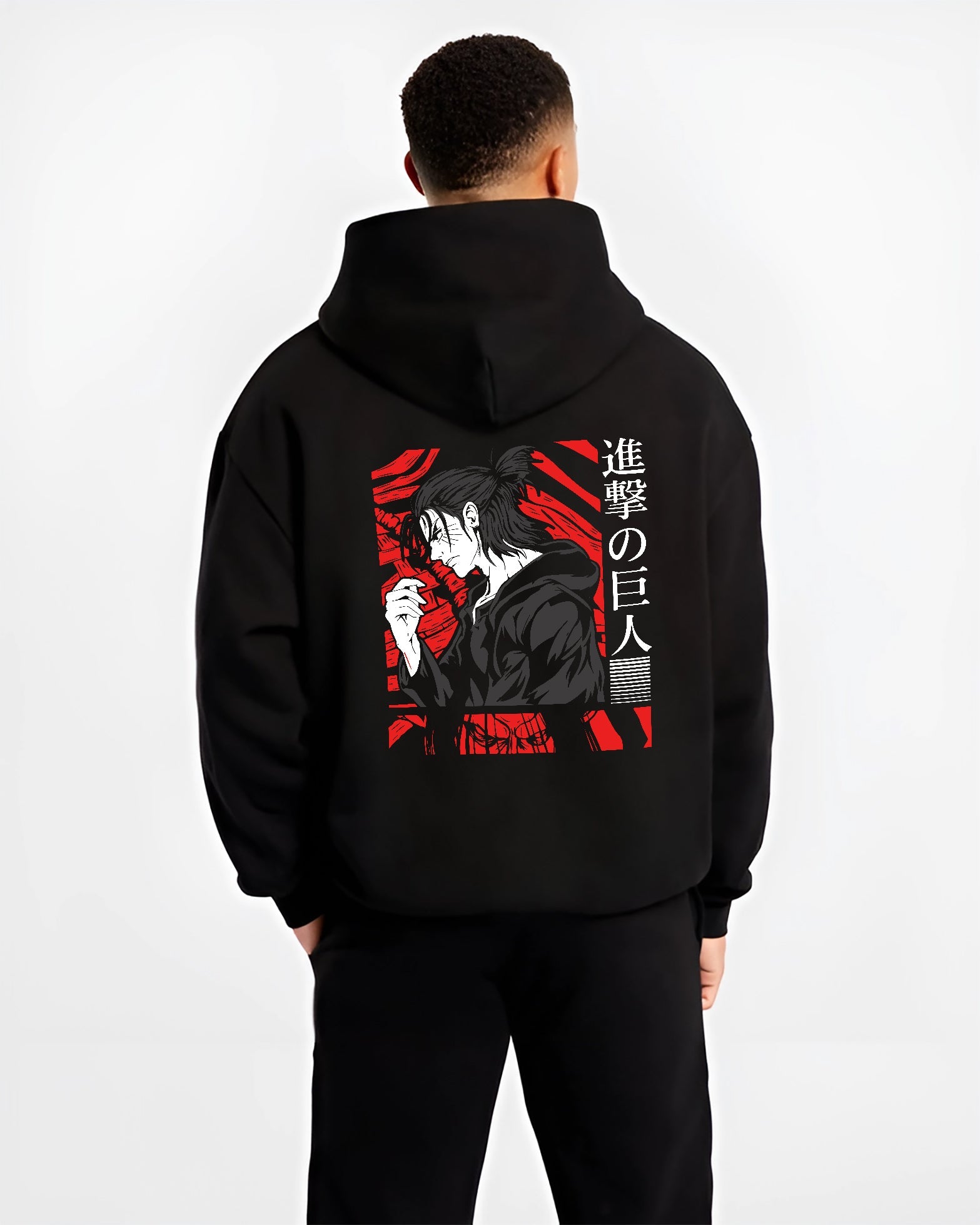 Black hoodie worn by a male model, back view, featuring Attack on Titan Eren Yeager anime poster inspired portrait artwork in gritty retro manga panel style with red accents.