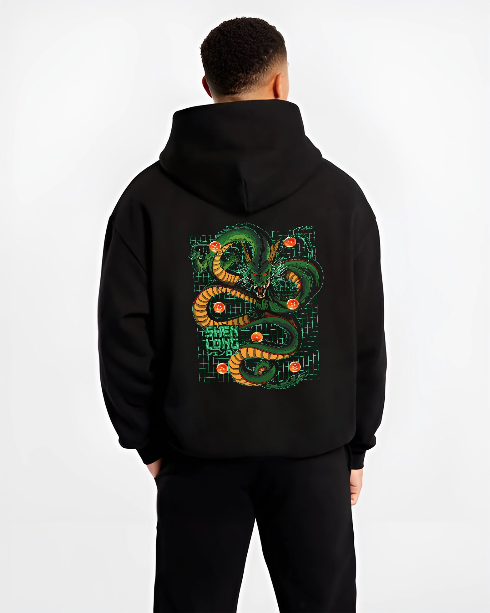 Black hoodie worn by a male model, back view, featuring Dragon Ball Shenron Japanese animation streetwear design with bold green dragon and retro grid artwork.