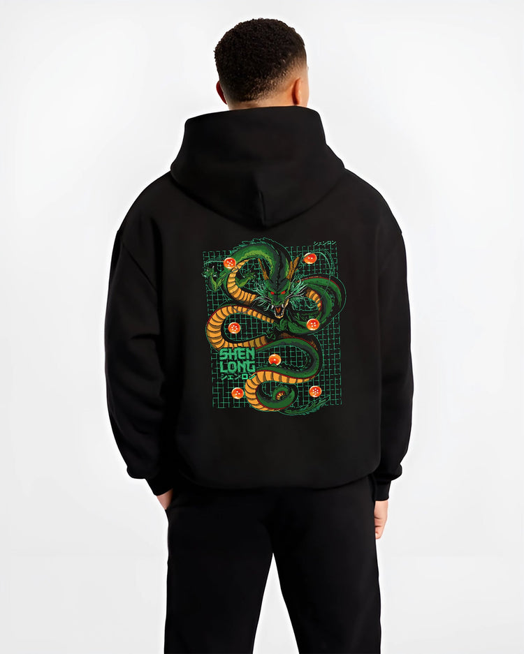Black hoodie worn by a male model, back view, featuring Dragon Ball Shenron Japanese animation streetwear design with bold green dragon and retro grid artwork.