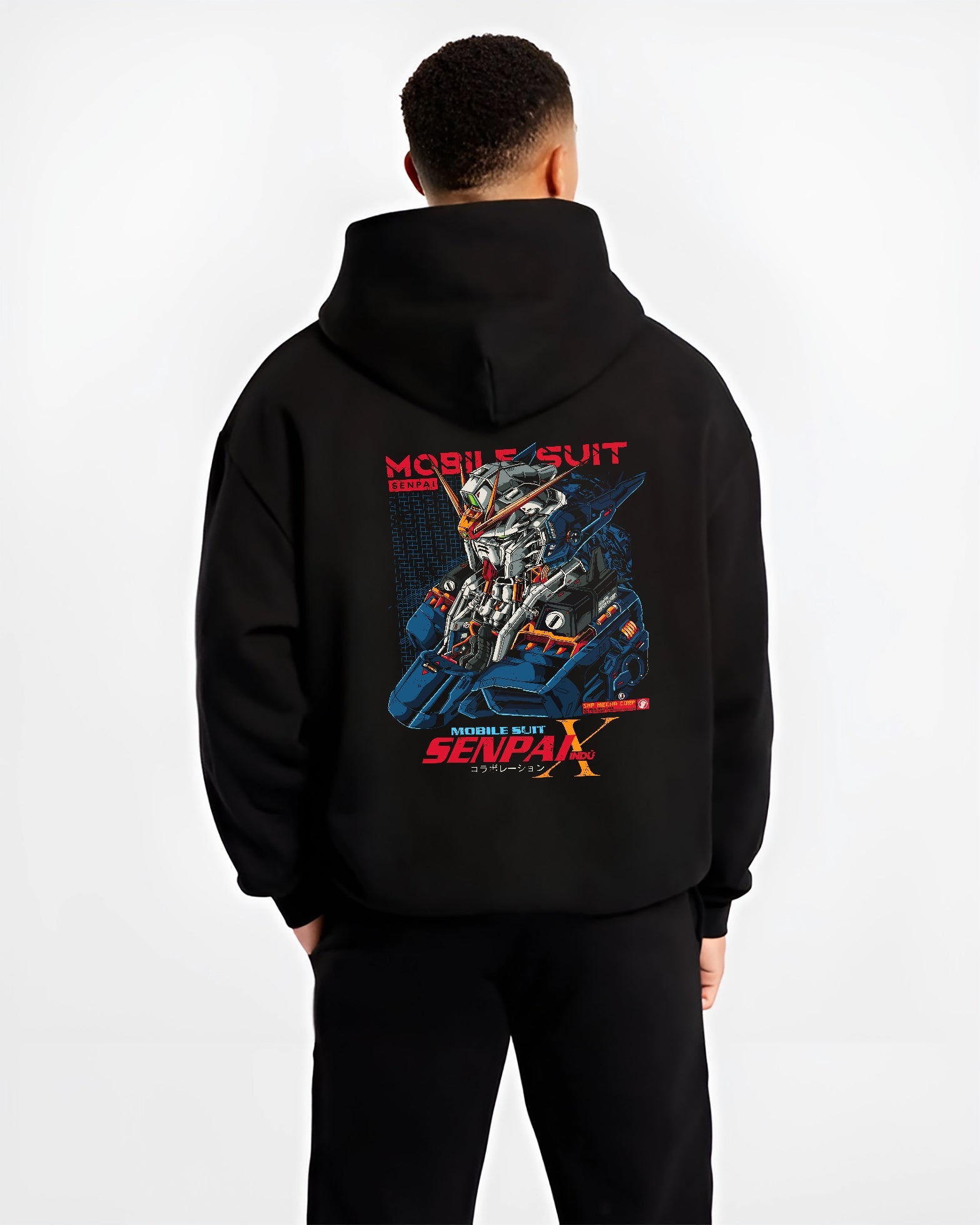 Black hoodie worn by a male model, back view, featuring Mobile Suit mecha helmet artwork in anime poster inspired retro manga style with cyberpunk aesthetic.