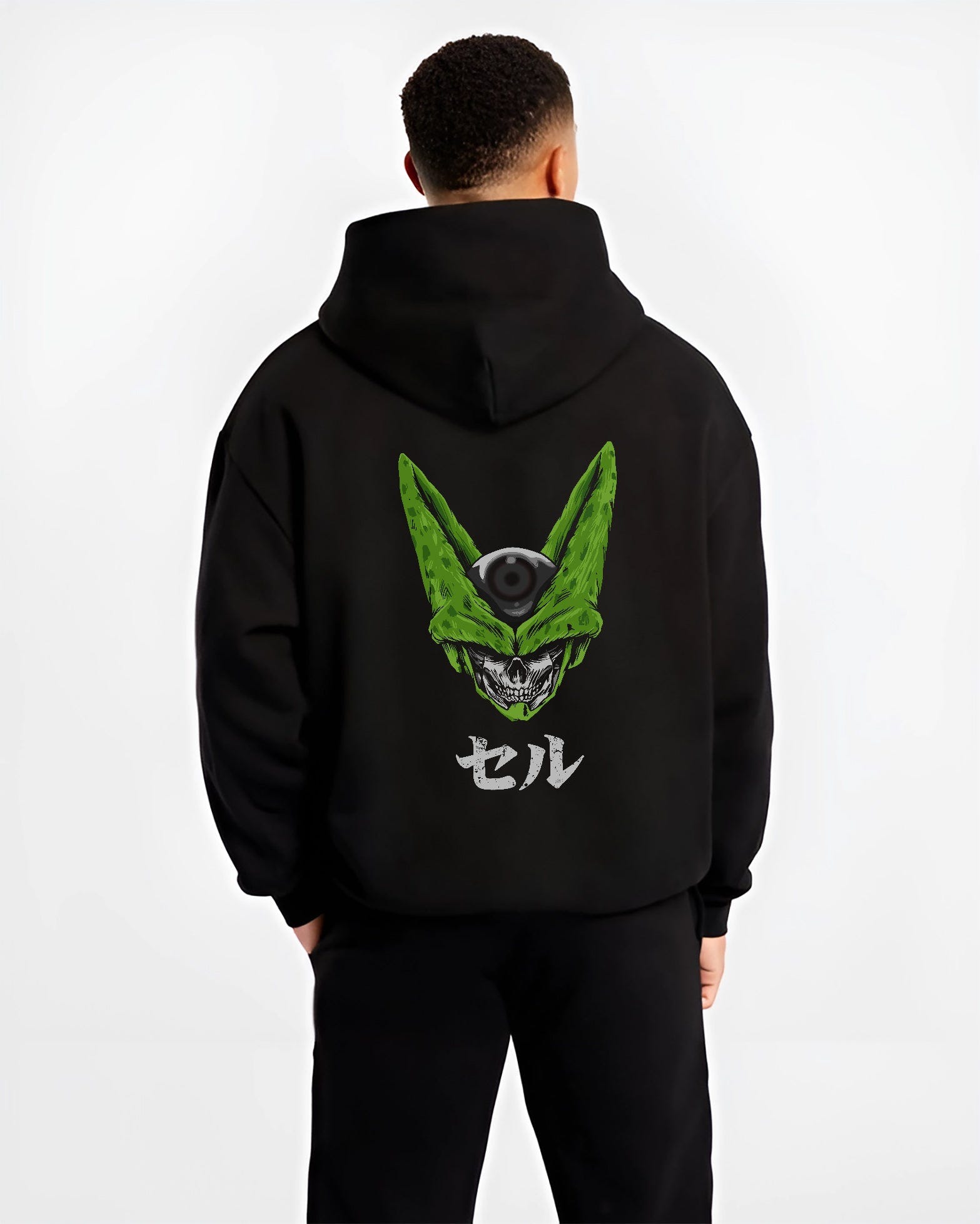 Black hoodie worn by a male model, back view, featuring Dragon Ball Cell skull fusion dark manga panel artwork in retro streetwear style.