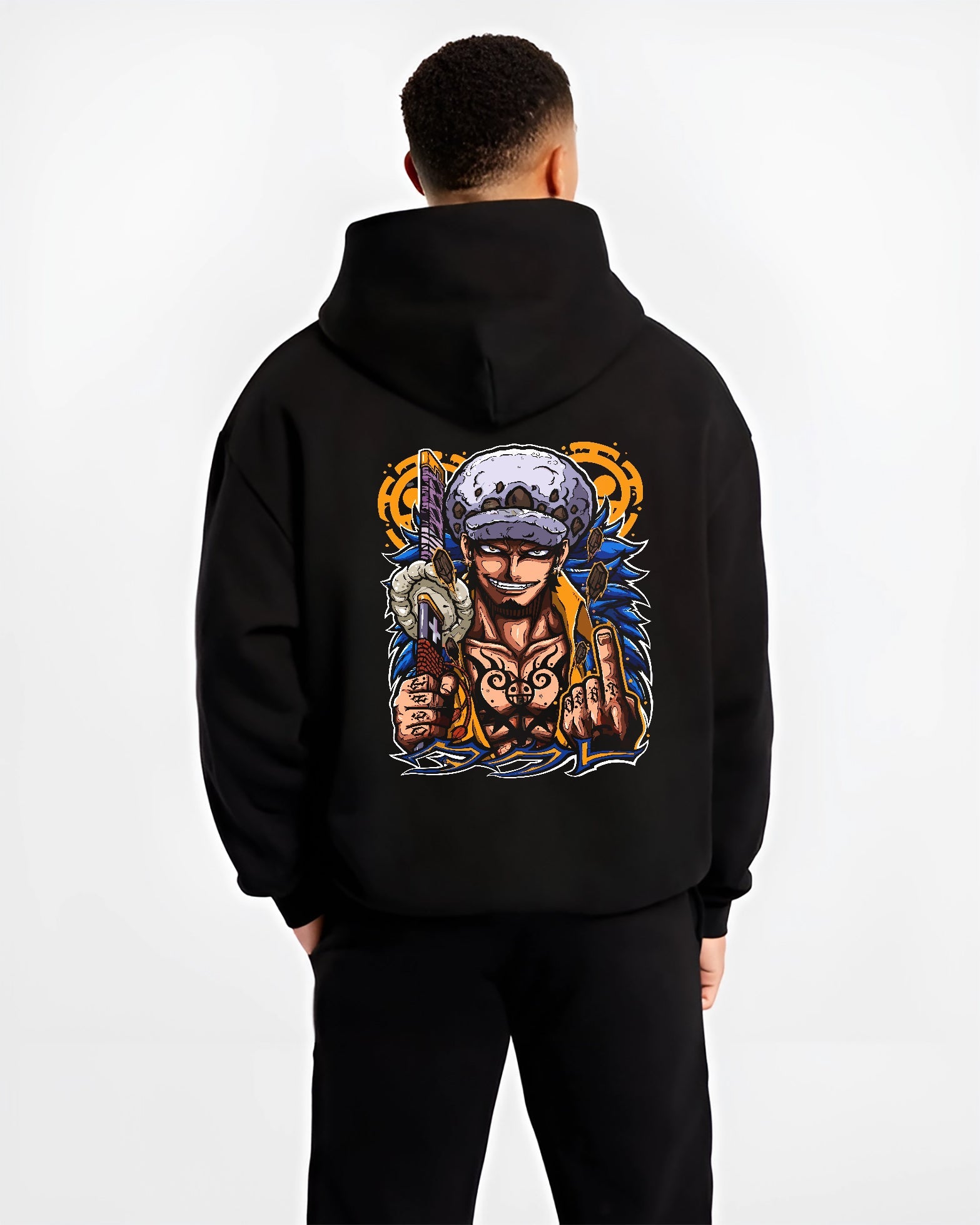 Black hoodie worn by a male model, back view, featuring One Piece Trafalgar Law retro manga artwork with sword and sharp grin.