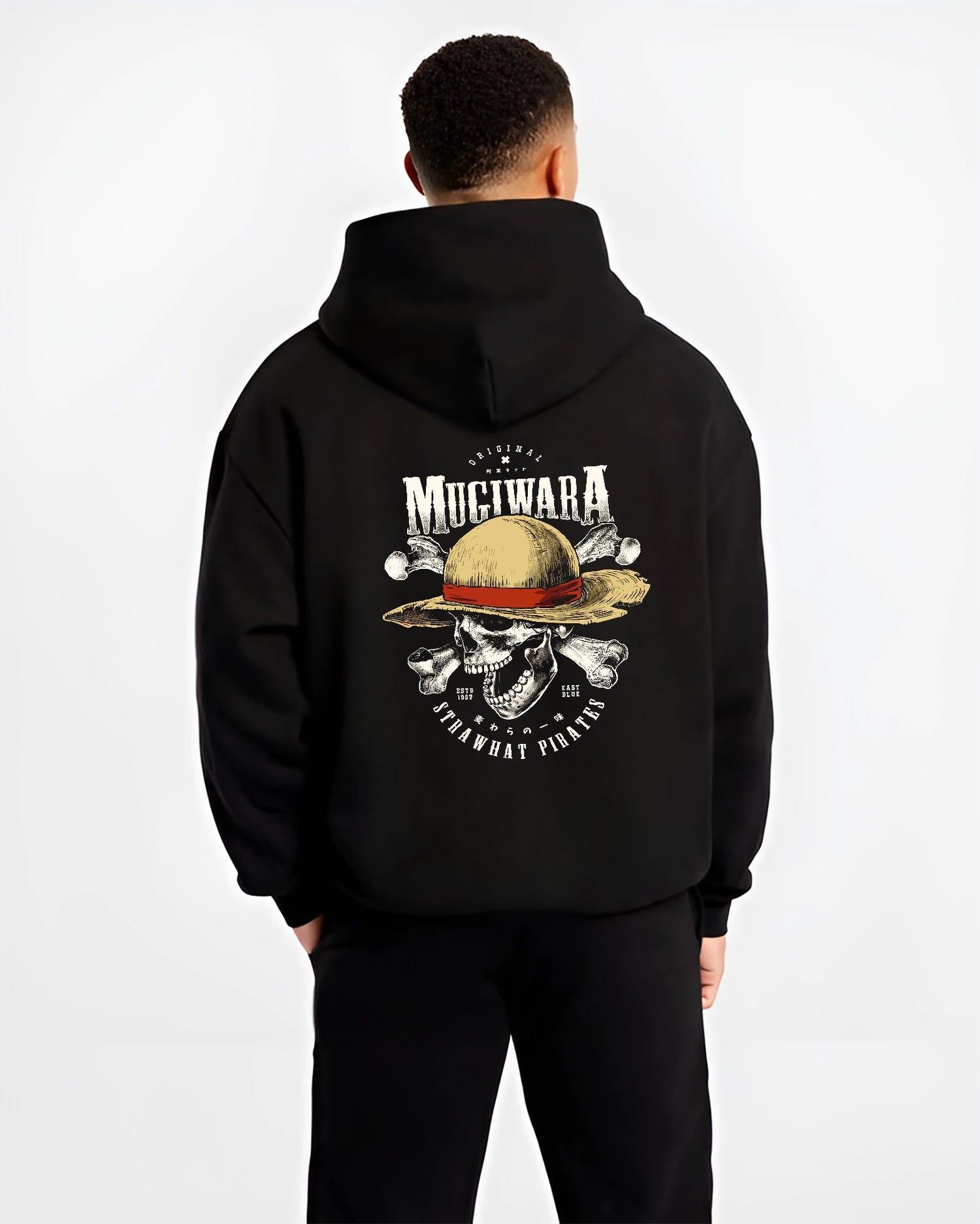 Black hoodie worn by a male model, back view, featuring One Piece Mugiwara skull and crossbones artwork in anime poster inspired design with retro streetwear vibe.