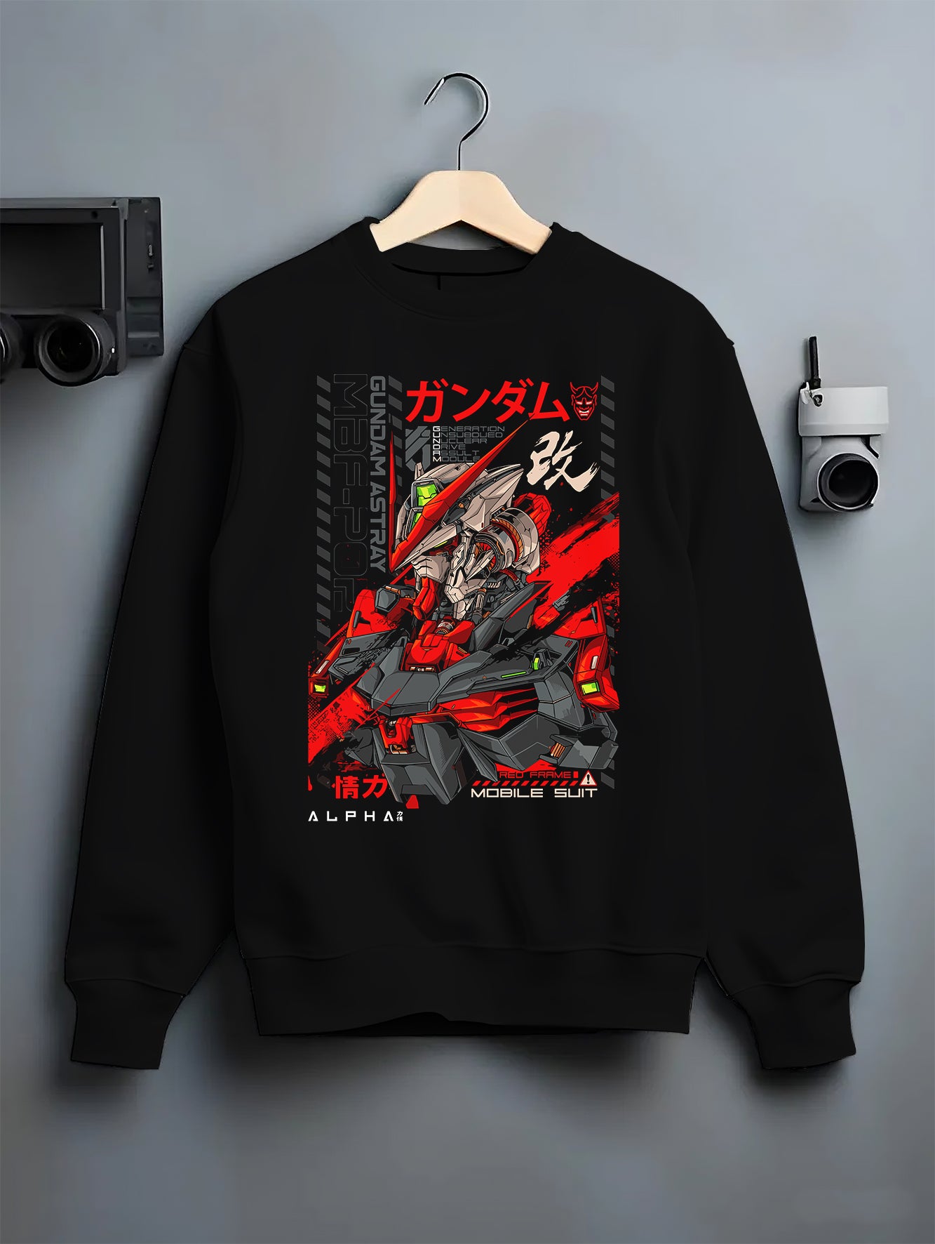 Black T-shirt laid flat with natural fabric folds, featuring Gundam Red Frame retro mecha design styled with anime poster inspired red mechanical detailing.