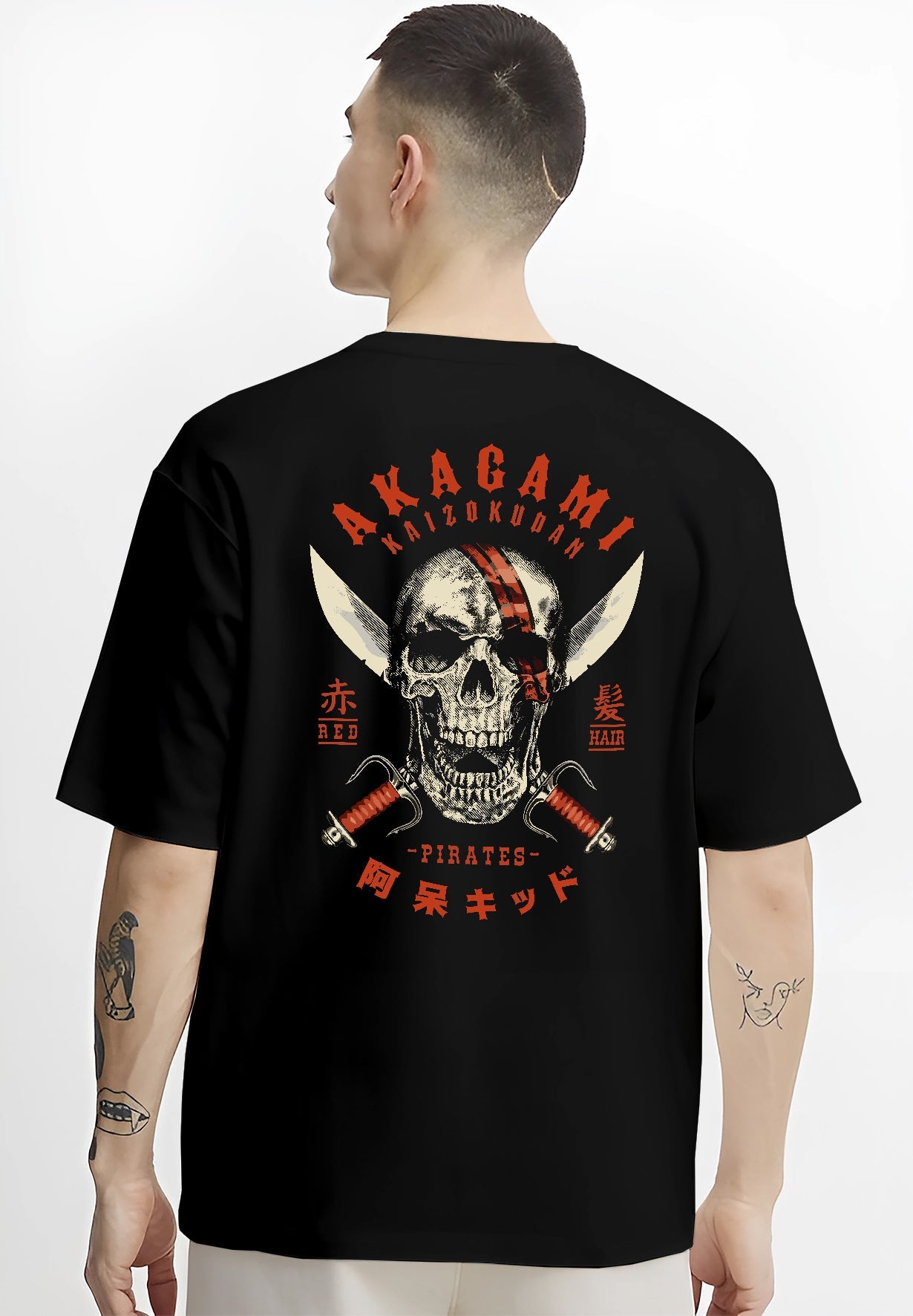 Black T-shirt worn by a male model, back view, featuring Akagami Red Hair Pirates skull comic villain inspired artwork with dark retro tones.