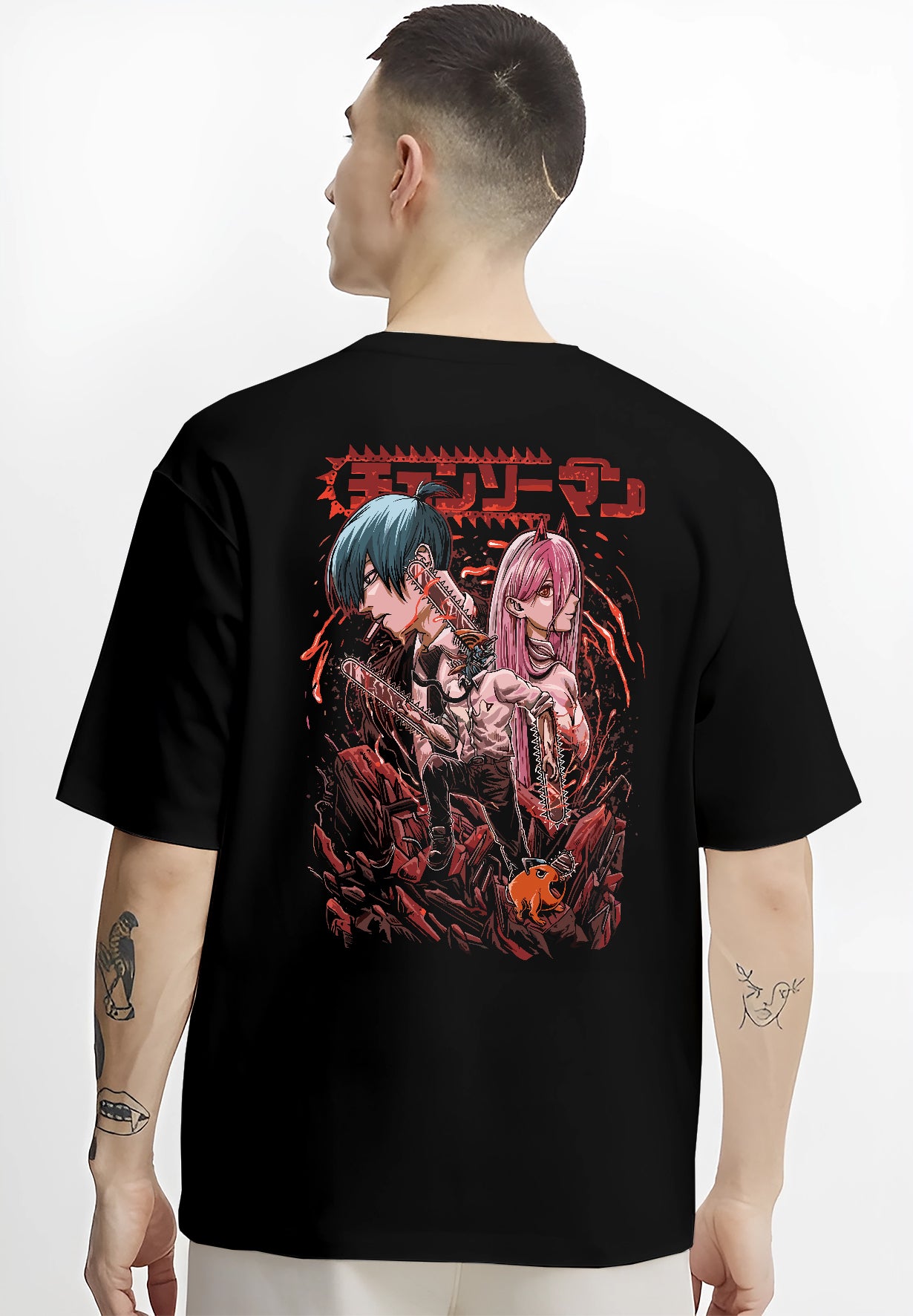 Black T-shirt worn by a male model, back view, featuring Chainsaw Man characters Power and Aki in anime poster inspired artwork with dark shonen battle vibe.
