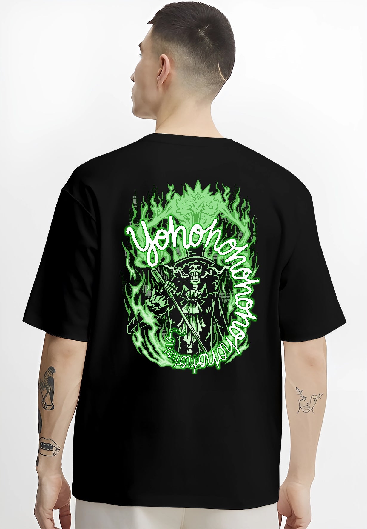 Black T-shirt worn by a male model, back view, featuring One Piece Brook anime poster inspired design surrounded by eerie neon flames in retro manga style.