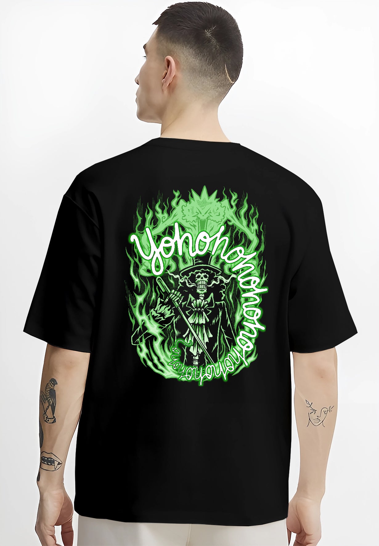 Black T-shirt worn by a male model, back view, featuring One Piece Brook anime poster inspired design surrounded by eerie neon flames in retro manga style.
