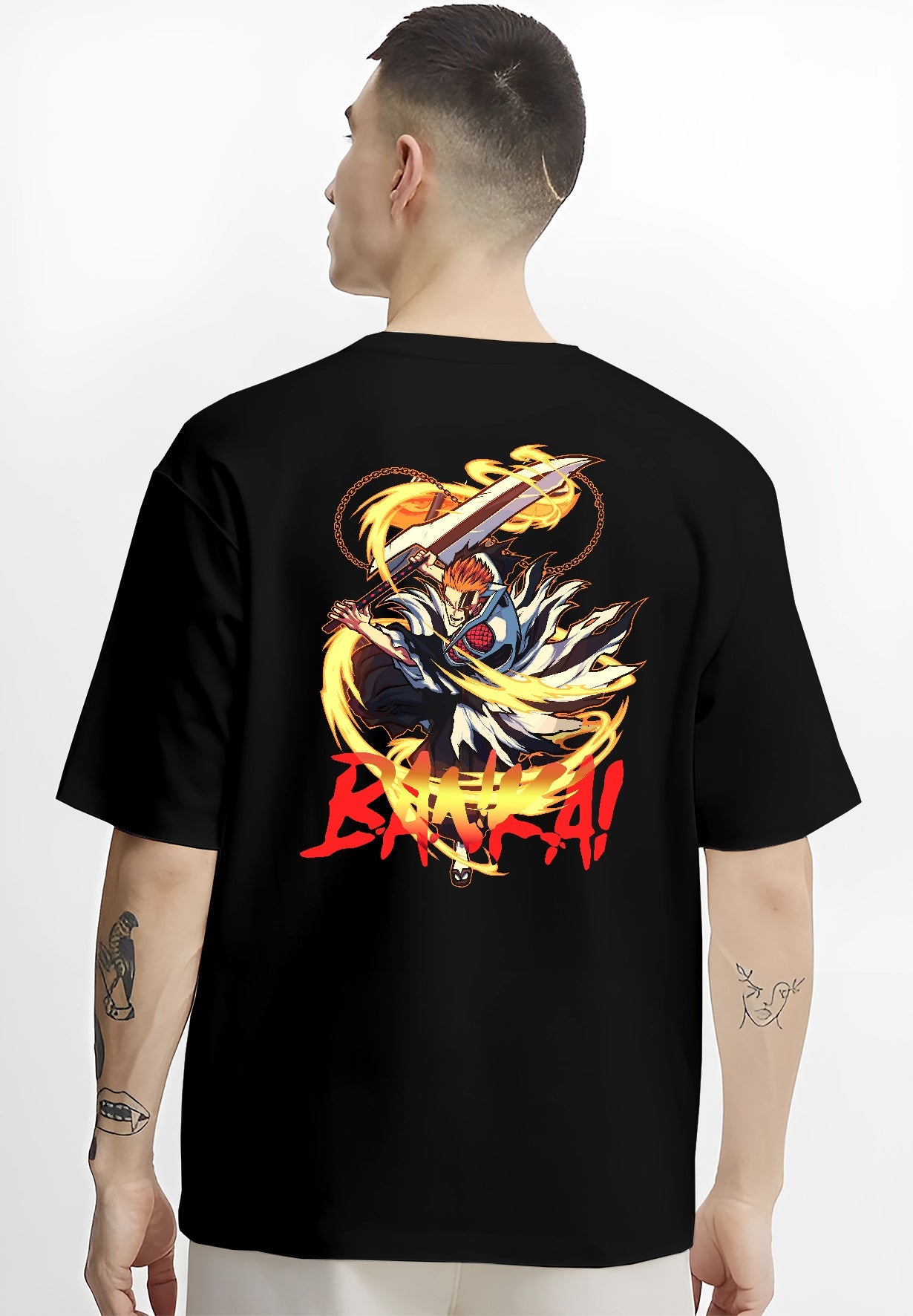 Black T-shirt worn by a male model, back view, featuring Ichigo Bankai anime poster inspired artwork with bold red lettering and flame aura.